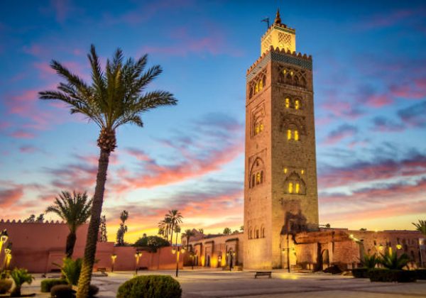 Koutoubia Mosque surrounded by palm trees in Marrakech, Morocco